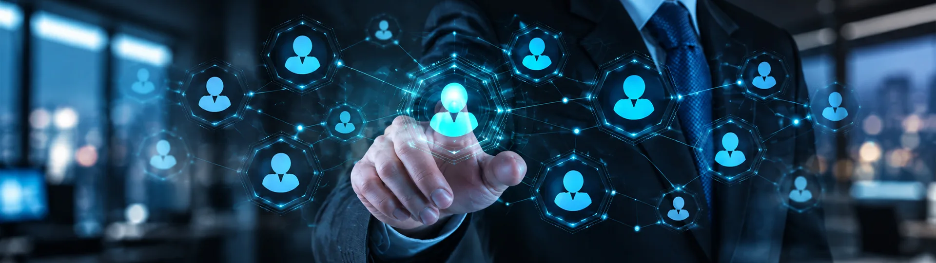 Businessman touching a glowing network of connected professional profile icons