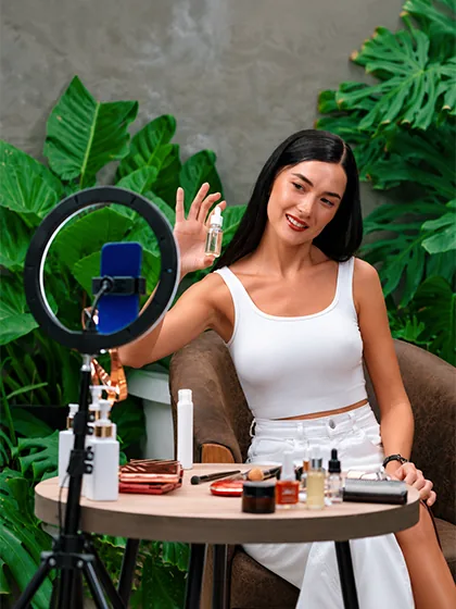 Beauty creator filming with a ring light