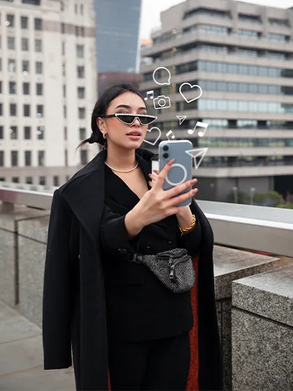Creator filming a selfie video outdoors